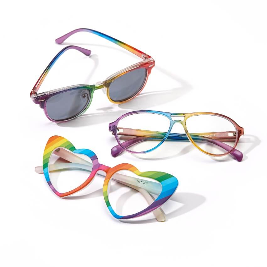 Three pairs of rainbow-colored glasses: one with heart shapes, one with round lenses, and one aviator style.