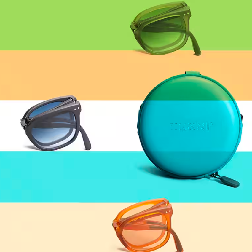 Foldable sunglasses in green, black, and orange next to a round teal case with the text "LENZMP".