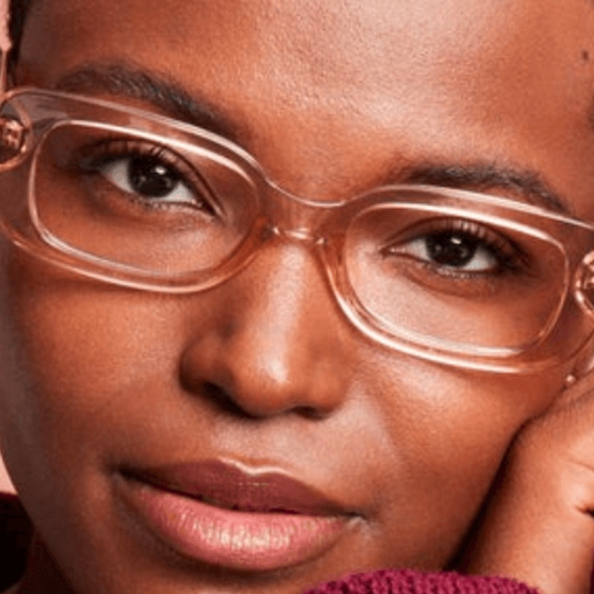 Woman wearing transparent glasses with a thin frame.