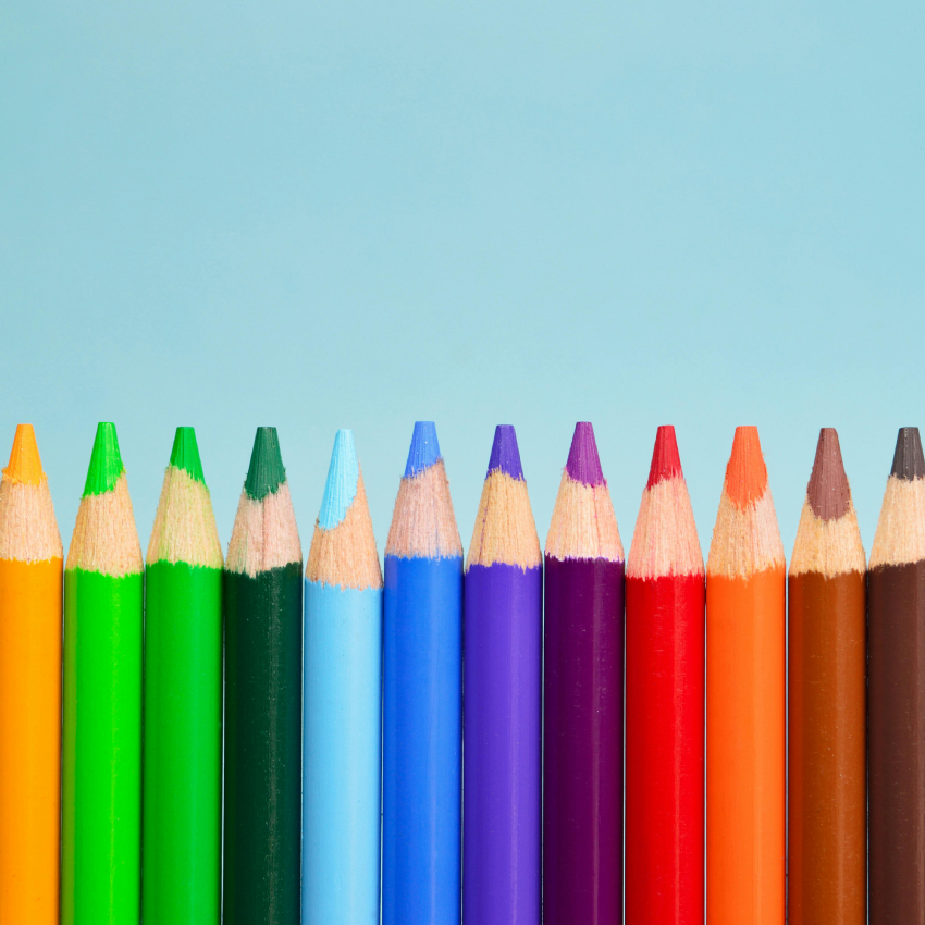 Colored pencils in a row: yellow, light green, green, dark green, light blue, blue, dark blue, purple, dark purple, red, orange, brown, black.