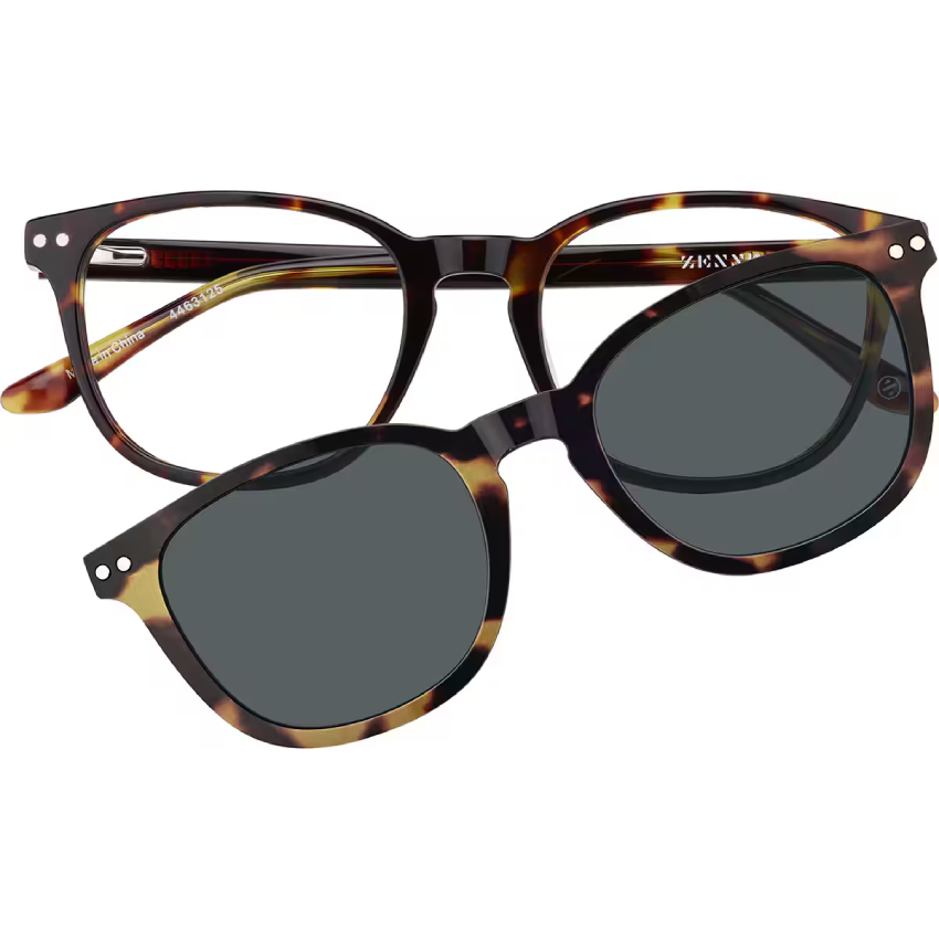 Tortoise-shell eyeglasses with attachable clip-on sunglasses, featuring black-tinted lenses.